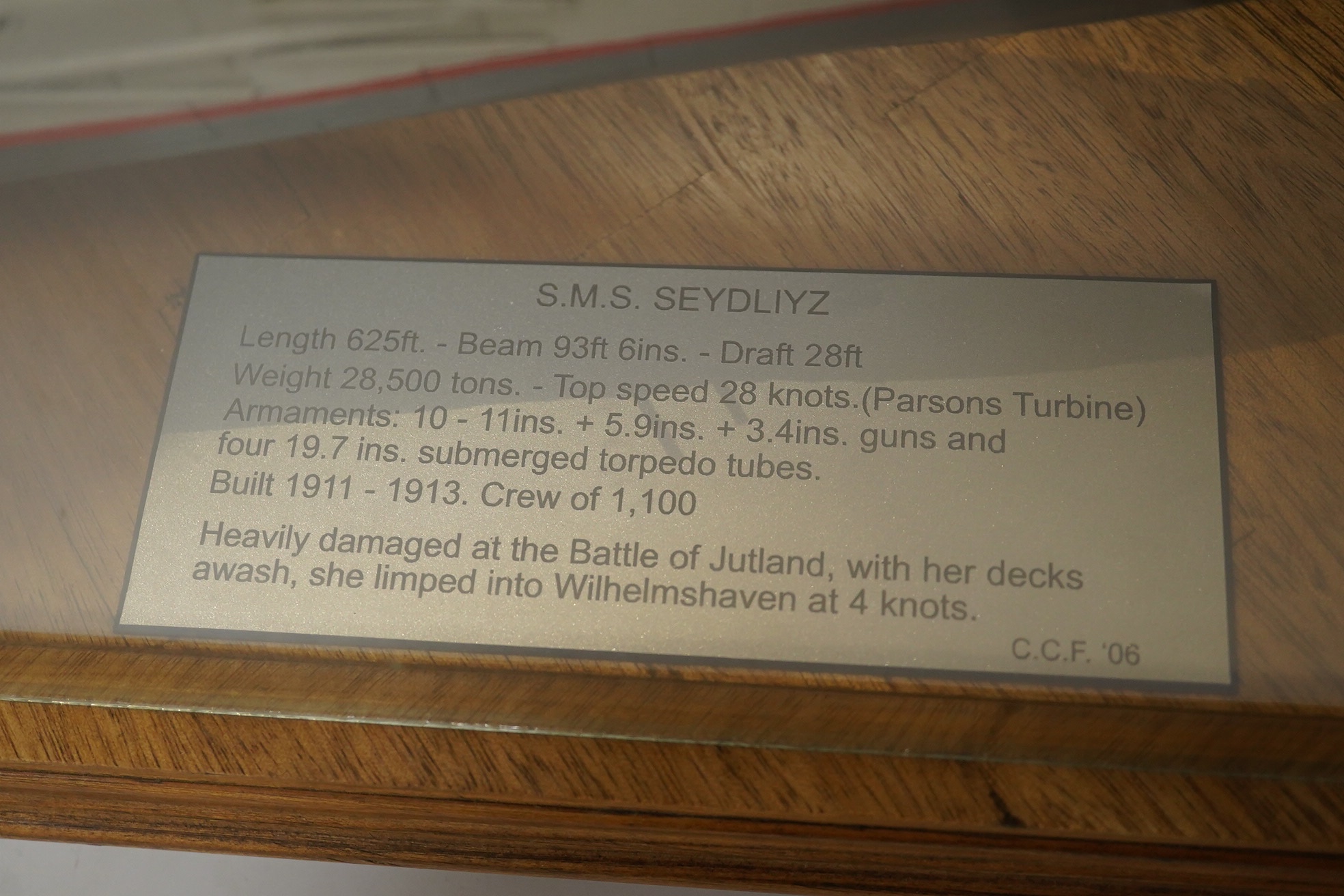 A cased Colin Freeman model of a German battle cruiser, S.M.S. Seydliyz, a well detailed model, with plaque describing the technical details and history regarding her involvement at the battle of Jutland, case 75 x 19.5